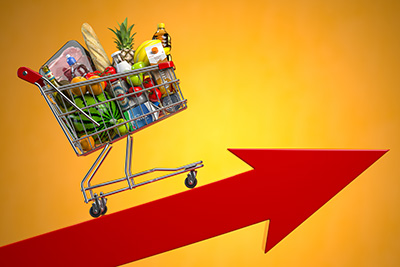 shopping cart full of food with red arrow pointed upward